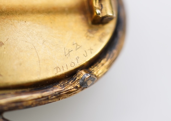 A reverse-carved and painted intaglio 'Essex crystal' brooch, late 19th century